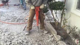 Jack Hammering Concrete With High Powered Air Jack Hammer [upl. by Otilesoj90]